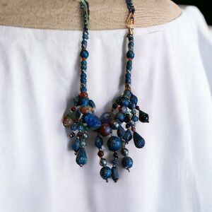 Vintage brass or copper dangle pendant with genuine stones throughout.
